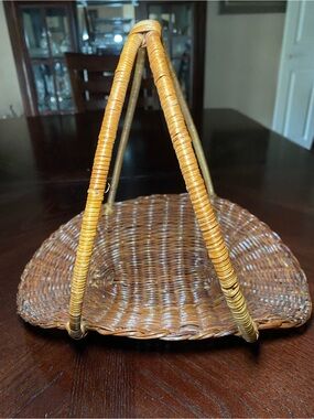 PRICED TO SELL! Crescent shaped Handwoven Wicker Basket large triangle handles.